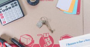 Flat lay of home buying essentials with calculator, keys, tape, and color swatches. Flat lay of home buying essentials with calculator, keys, tape, and color swatches.